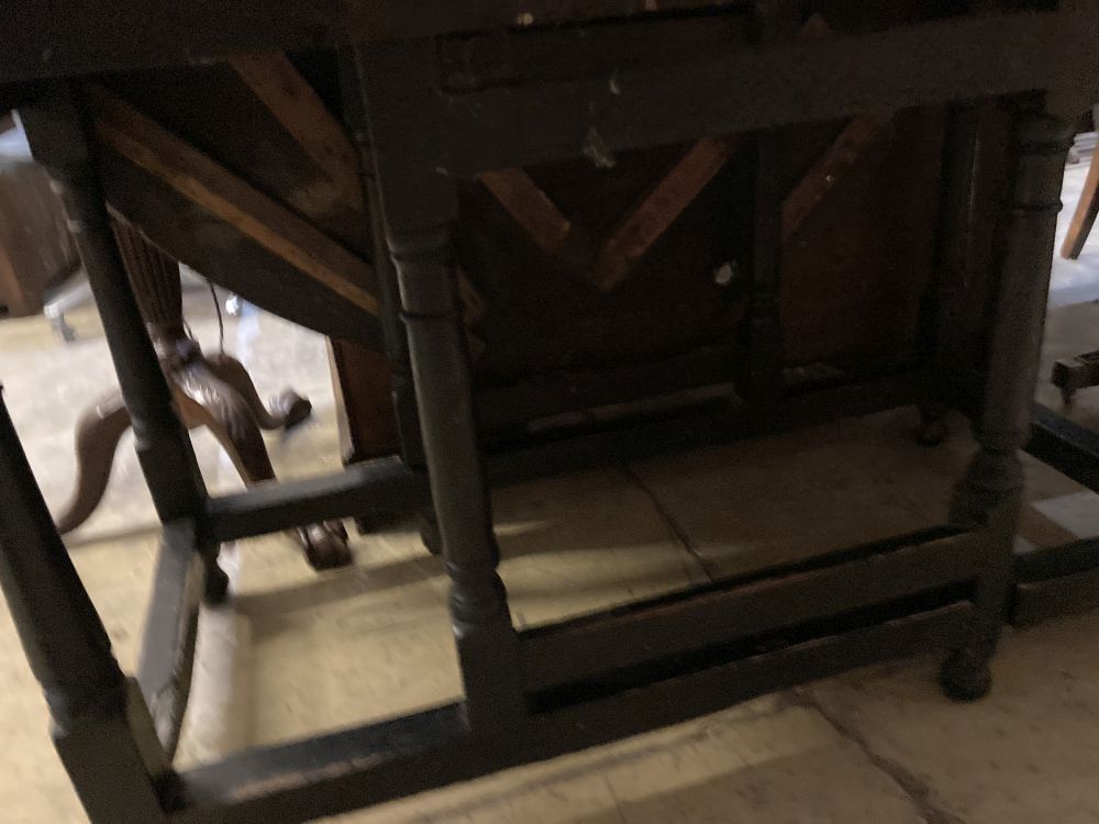 An 18th century oak gateleg dining table, width 128cm 150cm extended height 74cm